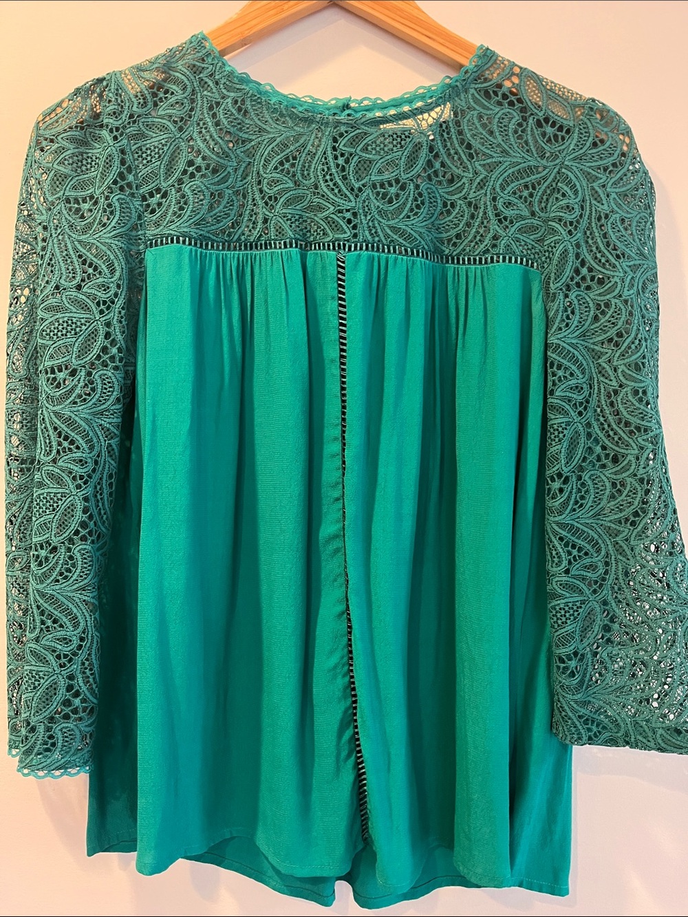 Emerald green blouse with detailed stitching